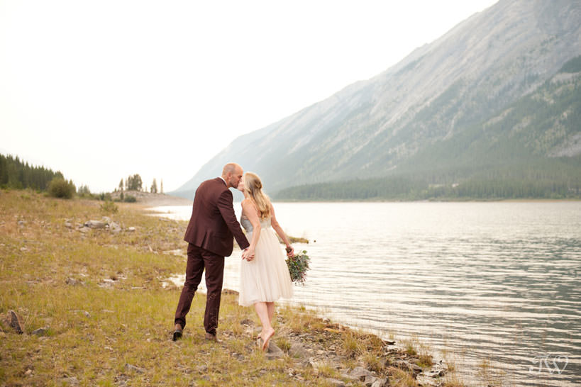 Caitie & Mark share a kiss at their Spray Lakes engagement session captured by Tara Whittaker Photography