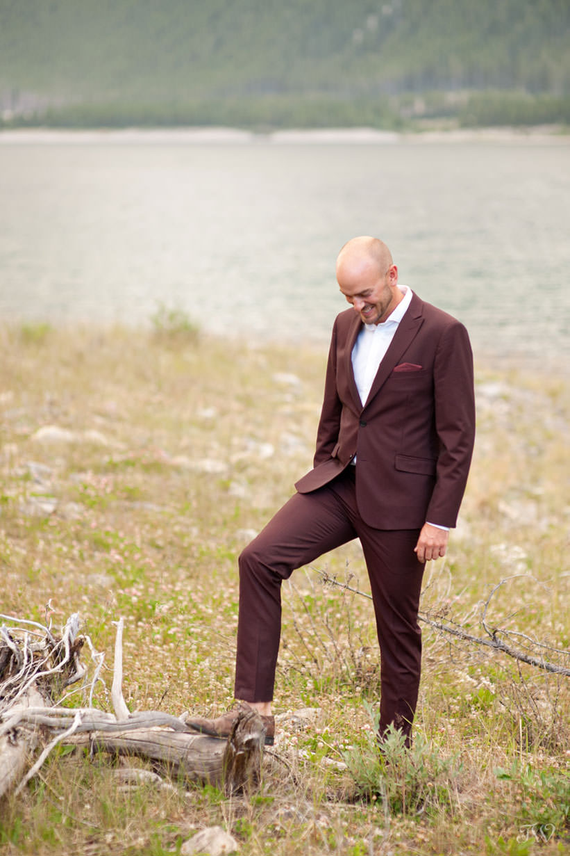 Groom on the shores of Spray Lakes captured by Tara Whittaker Photography