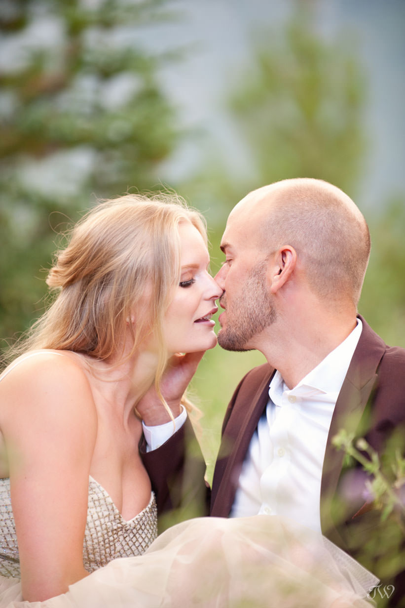 A kiss during a Spray Lakes engagement session captured by Tara Whittaker Photography
