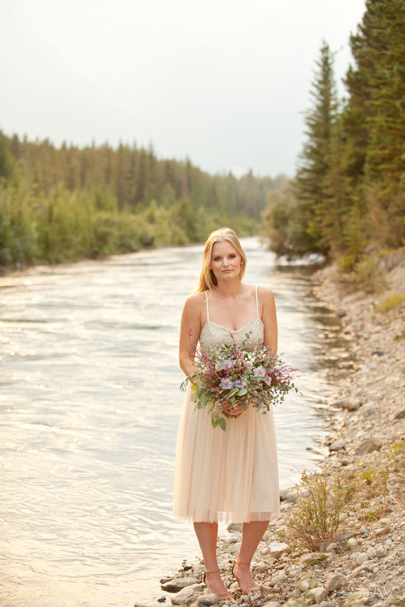 Bride with her bouquet during Spray Lakes engagement session captured by Tara Whittaker Photography