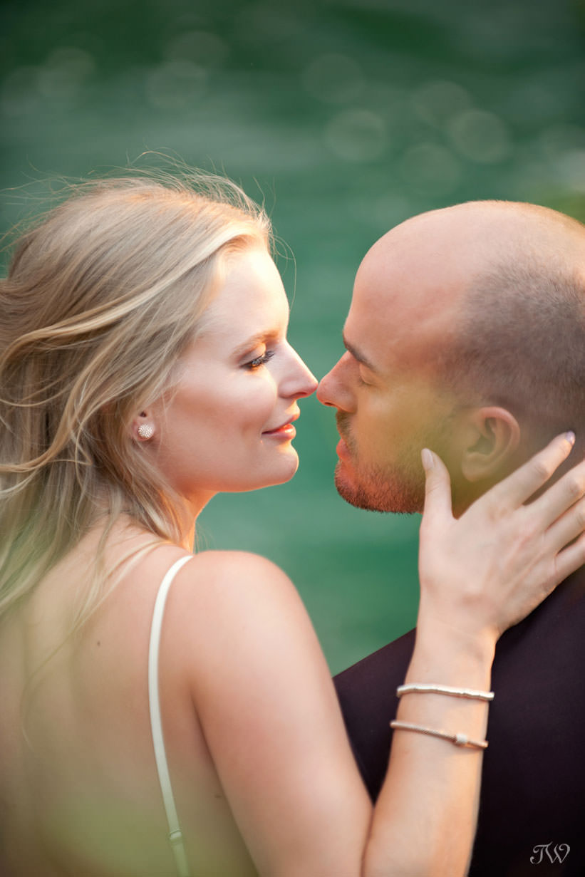 Couple embrace during their Spray Lakes engagement session captured by Tara Whittaker Photography